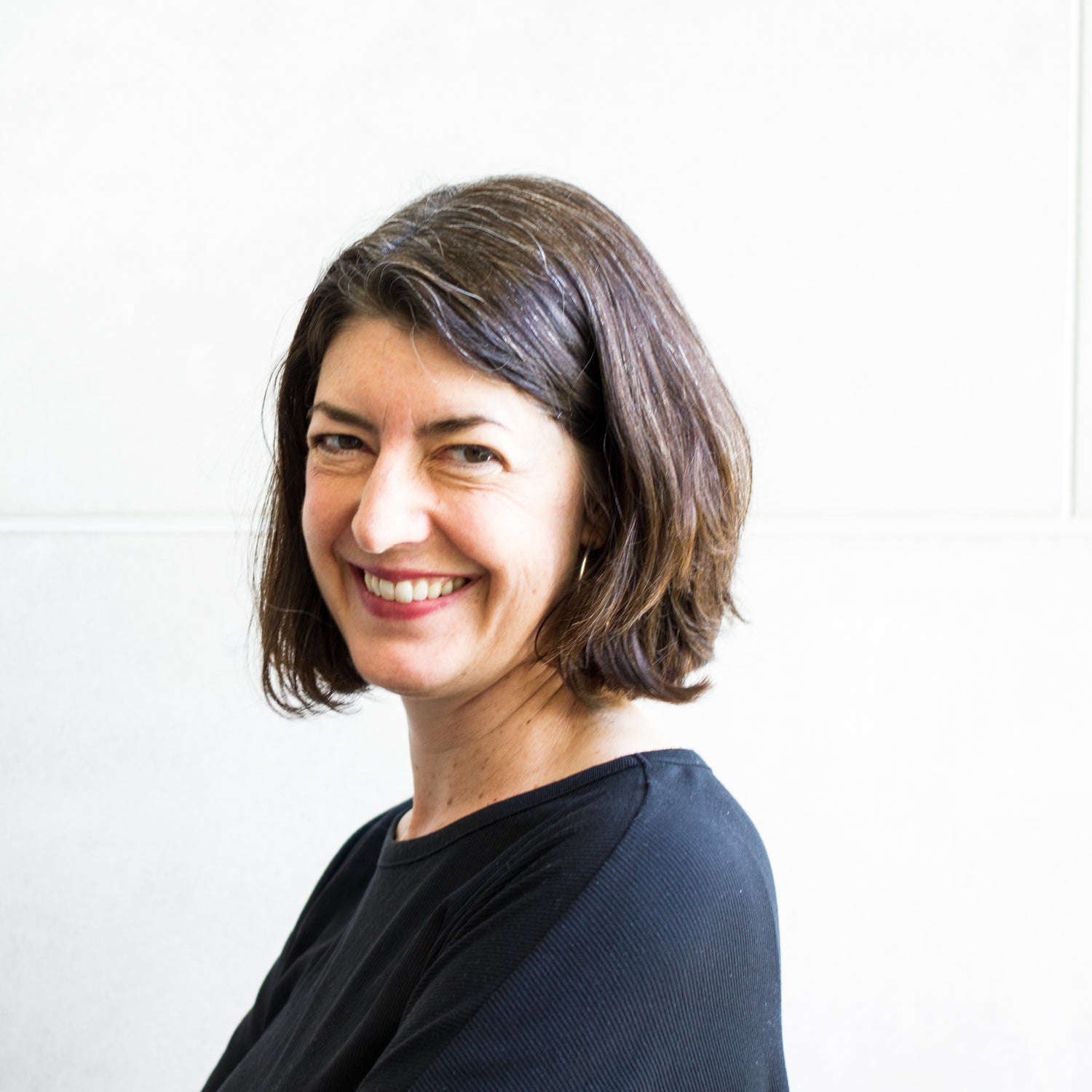 designer Pam Daniels smiling and wearing a black top