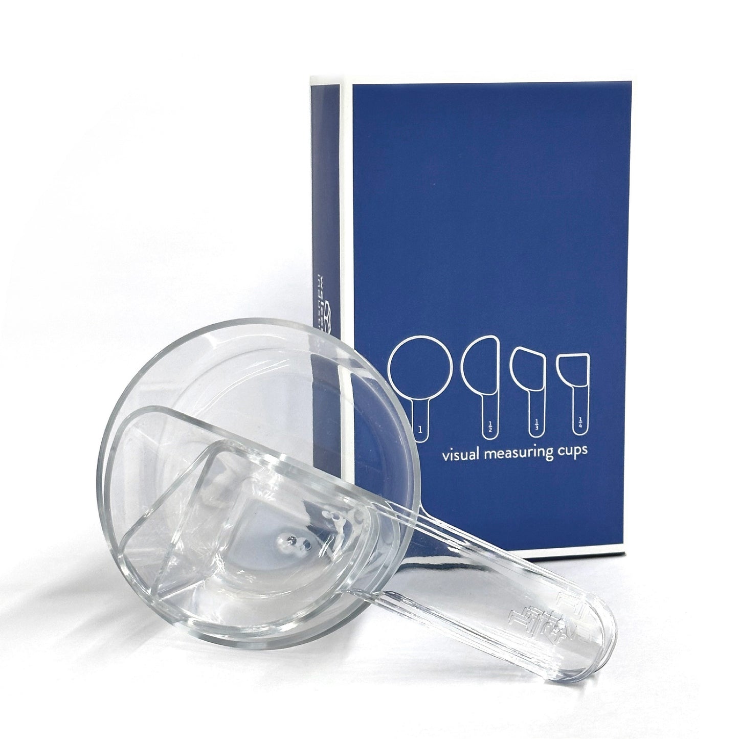 nested visual measuring cups rest on their side in front of blue gift-box packaging