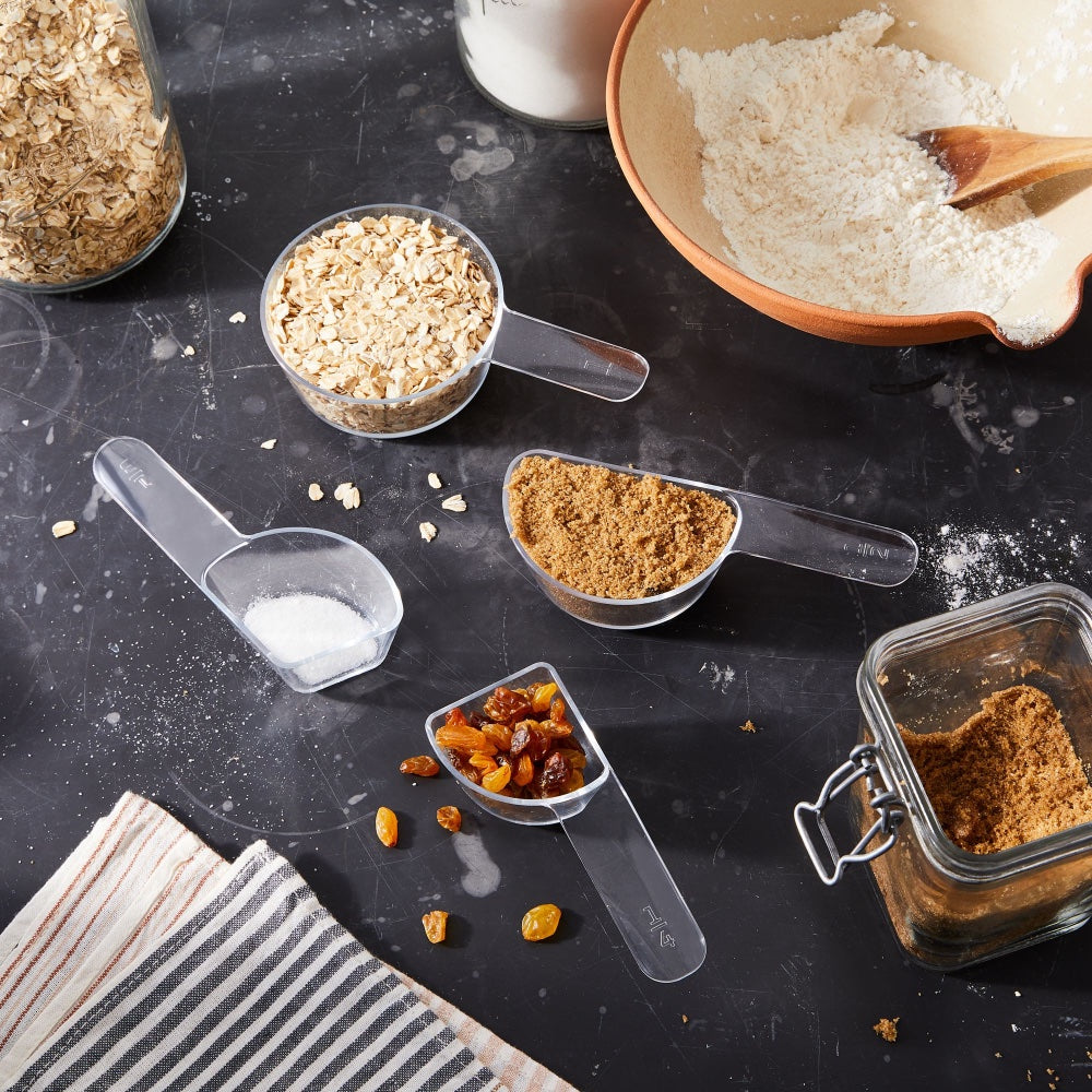 visual measuring cups are shown in use on a kitchen counter
