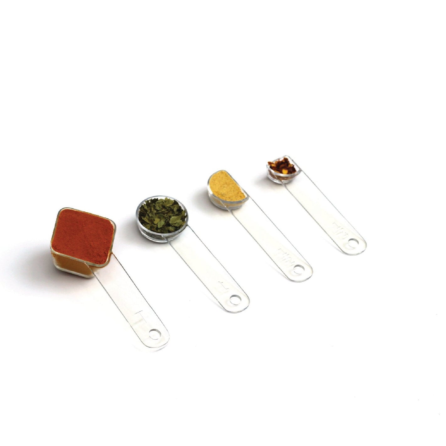 visual measuring spoons arranged in a row and filled with colorful spices 