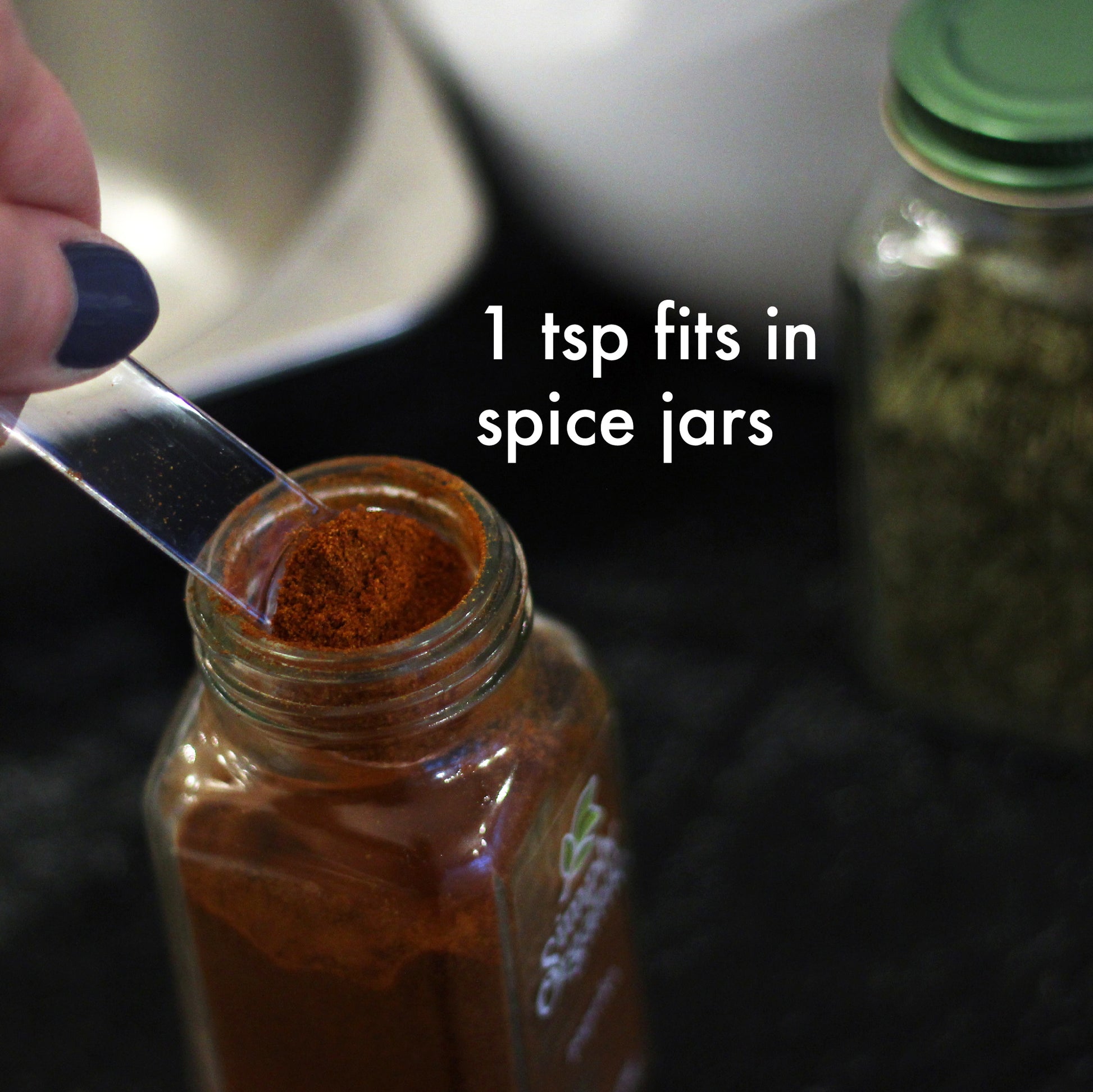 a teaspoon in a jar of paprika with the caption 1 teaspoon fits in spice jars